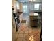 Charming kitchen with island, tile floors, white cabinets and modern appliances at 715 Honeysuckle Ave, Celebration, FL 34747