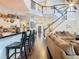 Open-concept layout features living room, kitchen and staircase to second floor at 715 Honeysuckle Ave, Celebration, FL 34747