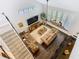 Spacious living room features natural light, a ceiling fan, and comfortable furniture at 715 Honeysuckle Ave, Celebration, FL 34747
