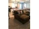 Open-concept living space with a comfortable couch and a view of the kitchen at 715 Honeysuckle Ave, Celebration, FL 34747