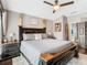 Comfortable main bedroom with neutral tones, stylish decor, and an attached bathroom at 715 Honeysuckle Ave, Celebration, FL 34747