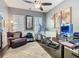 Comfortable office area with chair, desk, shelving, exercise equipment and a decorative area rug at 715 Honeysuckle Ave, Celebration, FL 34747