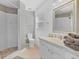 The bathroom features a walk-in shower, neutral wall coloring, and vanity at 7830 Myrtle Oak Ln, Kissimmee, FL 34747
