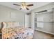 Bedroom features a ceiling fan, neutral walls and plush carpet; access to closet at 7830 Myrtle Oak Ln, Kissimmee, FL 34747