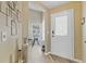 Inviting entryway featuring decorative vases and a frosted glass front door at 7830 Myrtle Oak Ln, Kissimmee, FL 34747
