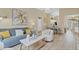 Inviting living room with comfortable seating and seamless flow into the dining area at 7830 Myrtle Oak Ln, Kissimmee, FL 34747