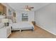 Bright bedroom with a ceiling fan, soft carpet, and large windows for ample natural light at 7830 Myrtle Oak Ln, Kissimmee, FL 34747
