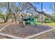 Community playground features play equipment and a wood chip ground at 7830 Myrtle Oak Ln, Kissimmee, FL 34747