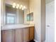 Bathroom with a large mirror and cabinet under the sink at 817 Grand Canal Dr, Kissimmee, FL 34759