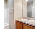 Bathroom featuring a vanity with a sink and a shower with white siding at 817 Grand Canal Dr, Kissimmee, FL 34759