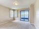 Bright bedroom with a sliding glass door providing natural light and serene water views at 817 Grand Canal Dr, Kissimmee, FL 34759