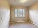 Neutral carpeted bedroom features a window with shutter blinds at 817 Grand Canal Dr, Kissimmee, FL 34759