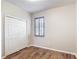 Bedroom with modern laminated floor and a closet at 817 Grand Canal Dr, Kissimmee, FL 34759