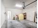 Spacious garage providing plenty of room for storage with multiple doors and lots of wall storage at 817 Grand Canal Dr, Kissimmee, FL 34759