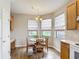 Charming breakfast nook with natural light, wood-look floors, and a stylish chandelier at 817 Grand Canal Dr, Kissimmee, FL 34759