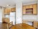 Kitchen with wood cabinets and a breakfast nook; plenty of counter space and storage at 817 Grand Canal Dr, Kissimmee, FL 34759