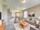 Spacious living room with neutral color palette, a comfortable seating arrangement, and natural light at 817 Grand Canal Dr, Kissimmee, FL 34759