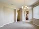 Open-concept living space featuring a chandelier and views into the kitchen at 817 Grand Canal Dr, Kissimmee, FL 34759