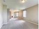 Expansive living room with neutral paint, plush carpet, and abundant natural light at 817 Grand Canal Dr, Kissimmee, FL 34759