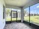 Relaxing screened in patio with beautiful view of back yard and neighboring home at 817 Grand Canal Dr, Kissimmee, FL 34759