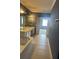 Bathroom featuring tile floor, double sink vanity, bathtub and view into the bedroom at 8369 Riverdale Ln # 1, Davenport, FL 33896