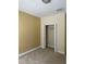 Bedroom with neutral colored walls and carpet flooring at 8369 Riverdale Ln # 1, Davenport, FL 33896