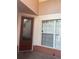 Inviting front entryway features a decorative glass door and a sidelight window with white trim at 8369 Riverdale Ln # 1, Davenport, FL 33896