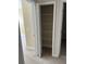 Empty hall closet with multiple metal shelves at 8369 Riverdale Ln # 1, Davenport, FL 33896