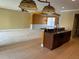 Open-concept kitchen with granite countertops and a view to the living room and dining room at 8369 Riverdale Ln # 1, Davenport, FL 33896