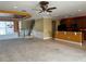 Open-concept living room and kitchen with a view of the staircase and dining area at 8369 Riverdale Ln # 1, Davenport, FL 33896
