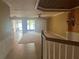 Open-concept living room with large sliding glass doors and lake views at 8369 Riverdale Ln # 1, Davenport, FL 33896