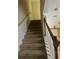 Carpeted staircase leading to the second floor of the home at 8369 Riverdale Ln # 1, Davenport, FL 33896