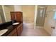 Bathroom featuring double sink vanity, soaking tub and glass shower at 954 Hacienda Cir, Kissimmee, FL 34741