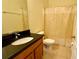 Bathroom featuring a granite vanity and a shower curtain at 954 Hacienda Cir, Kissimmee, FL 34741