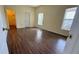 Bright bedroom with wood-look floors and walk-in closet at 954 Hacienda Cir, Kissimmee, FL 34741