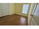 Bedroom with wood-look flooring, closet and natural light at 954 Hacienda Cir, Kissimmee, FL 34741