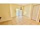 Open dining area with tile flooring and sliding glass doors leading to the outdoor patio at 954 Hacienda Cir, Kissimmee, FL 34741