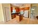 Bright kitchen with stainless steel appliances, granite countertops, and a center island at 954 Hacienda Cir, Kissimmee, FL 34741