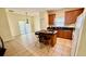 Bright eat-in kitchen featuring a functional island with seating and natural light at 954 Hacienda Cir, Kissimmee, FL 34741