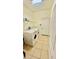 Bright laundry room with white appliances and tiled flooring at 954 Hacienda Cir, Kissimmee, FL 34741