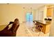 Open living space with a kitchen island, tile flooring, and sliding glass doors to the outdoor patio at 954 Hacienda Cir, Kissimmee, FL 34741