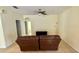 Spacious living room with ceiling fan and tile flooring throughout at 954 Hacienda Cir, Kissimmee, FL 34741