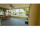 Relaxing screened patio with ceiling fan and lake view, perfect for enjoying outdoor living at 954 Hacienda Cir, Kissimmee, FL 34741