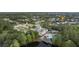 Aerial view highlighting the neighborhood clock tower, pool, and proximity of the property at 14314 Pleach St, Winter Garden, FL 34787