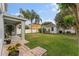 View of the spacious backyard featuring a utility shed and well-manicured lawn at 14314 Pleach St, Winter Garden, FL 34787