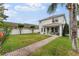 Beautiful backyard with well-maintained lawn and brick pathway at 14314 Pleach St, Winter Garden, FL 34787