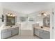 A spacious bathroom with double sinks, a soaking tub, and a separate glass shower at 14314 Pleach St, Winter Garden, FL 34787