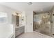 Bright bathroom featuring a large glass shower, a window, and a stylish vanity at 14314 Pleach St, Winter Garden, FL 34787