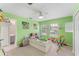 A colorful bedroom with a trundle bed, carpeted floor, and a connecting bathroom at 14314 Pleach St, Winter Garden, FL 34787