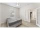 Bright bedroom with a ceiling fan, wood-look floors, a window, and a closet at 14314 Pleach St, Winter Garden, FL 34787